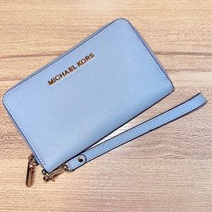 Michael Kors wristlet in great condition! Minor scuff on gold zipper.